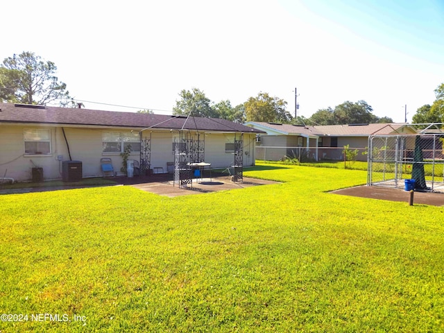 view of yard featuring a patio and central AC unit