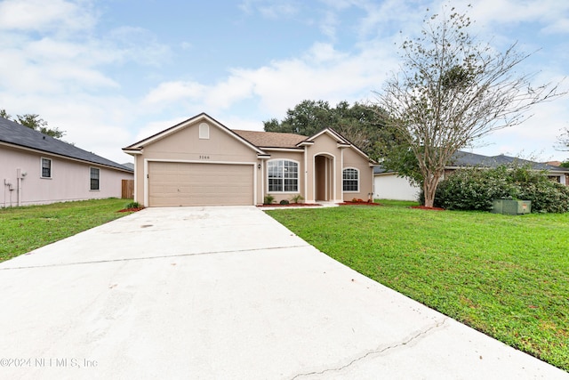 single story home with a front yard and a garage