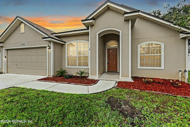 ranch-style home with a garage