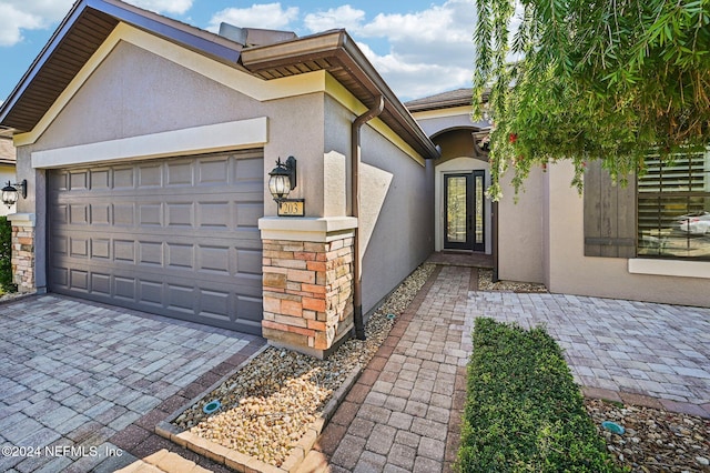 doorway to property featuring a garage