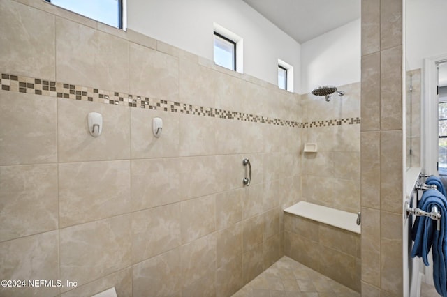 bathroom featuring tiled shower