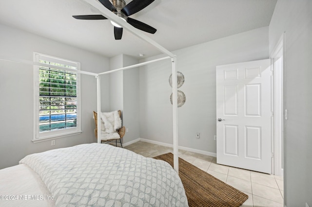 bedroom featuring ceiling fan and light tile patterned floors