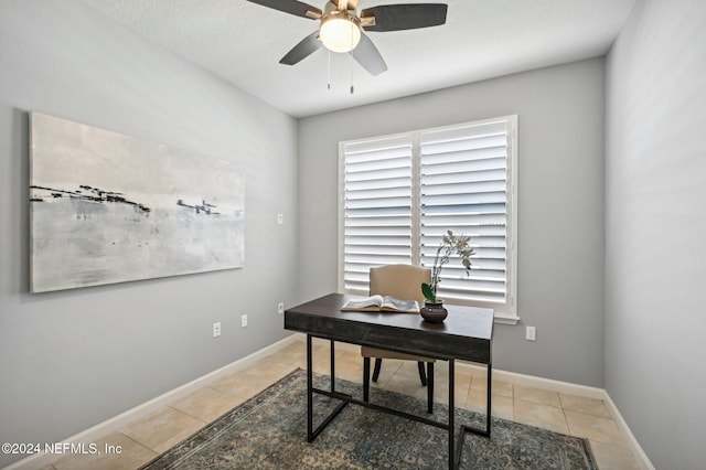 office space with ceiling fan and tile patterned flooring