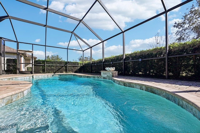 view of pool featuring a lanai