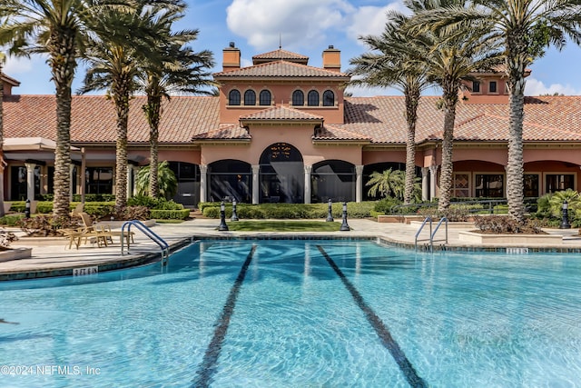 view of swimming pool featuring a patio area