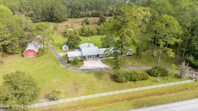 birds eye view of property with a rural view