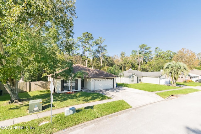 ranch-style house with a garage and a front lawn