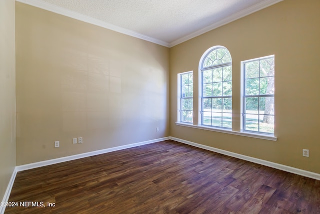 unfurnished room with crown molding, a textured ceiling, and dark wood-type flooring