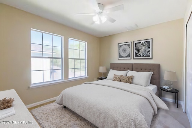 carpeted bedroom featuring ceiling fan