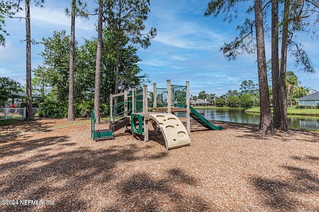 view of jungle gym featuring a water view