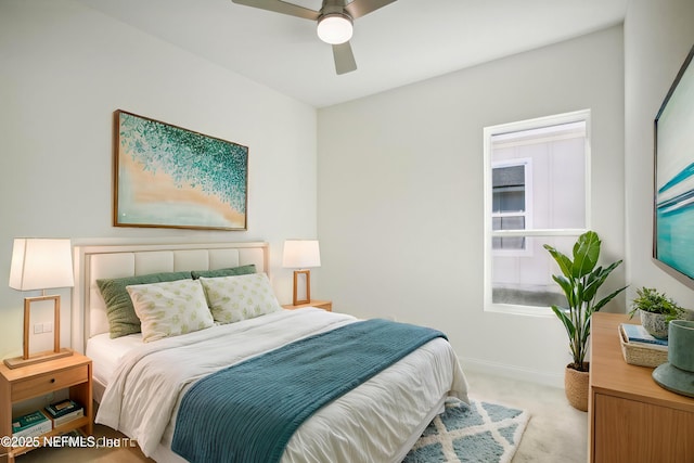 bedroom featuring ceiling fan and light colored carpet