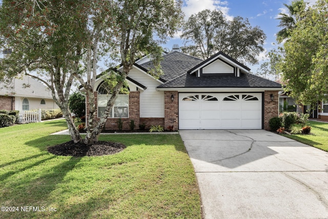 view of front facade with a front lawn and a garage