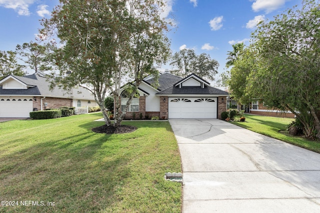 ranch-style home with a front yard and a garage