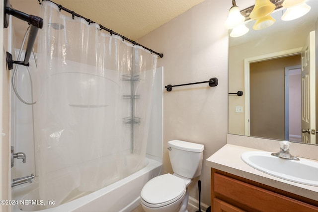 full bathroom featuring toilet, a textured ceiling, shower / bath combination with curtain, and vanity