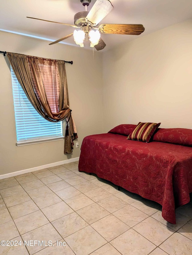 tiled bedroom with ceiling fan