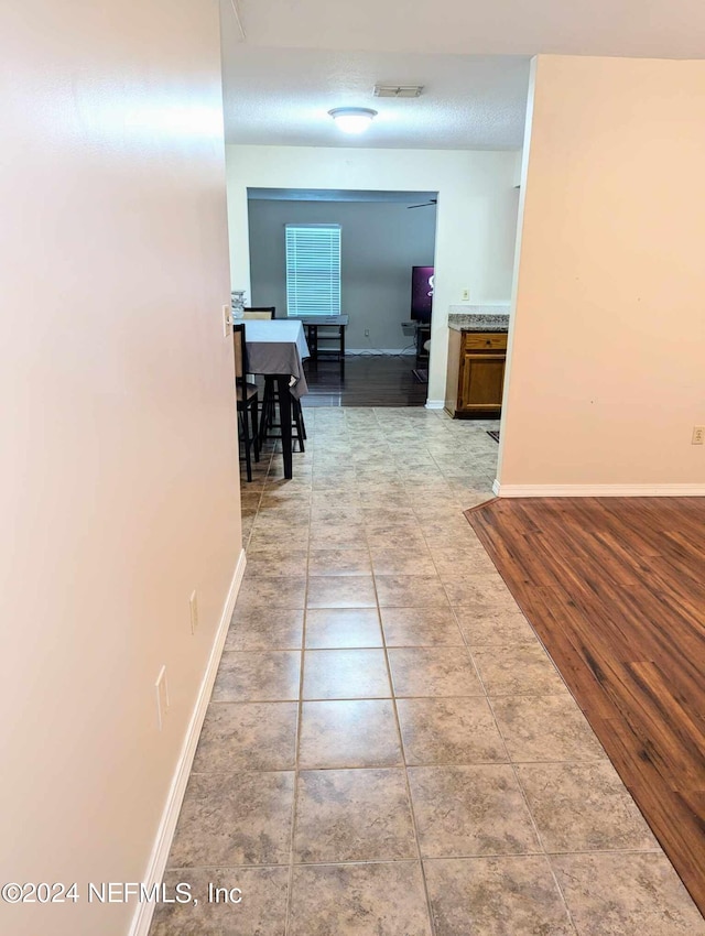 corridor featuring light hardwood / wood-style floors