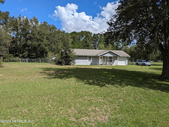 view of front facade featuring a garage and a front lawn