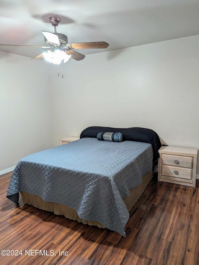 bedroom featuring dark hardwood / wood-style floors and ceiling fan