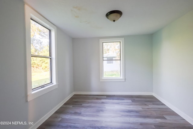 spare room featuring dark hardwood / wood-style floors