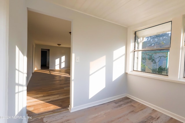 unfurnished room featuring hardwood / wood-style floors