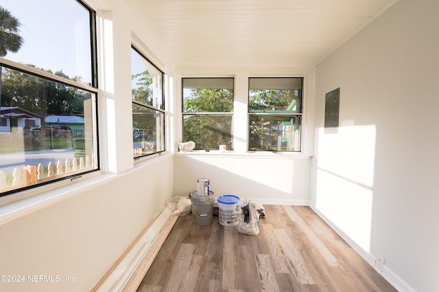 unfurnished sunroom with electric panel