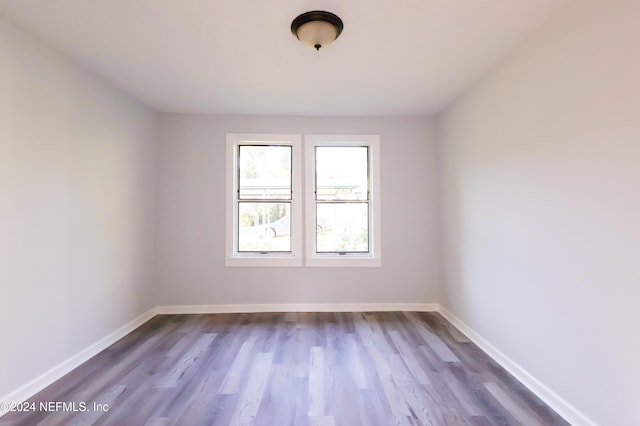 spare room featuring hardwood / wood-style flooring