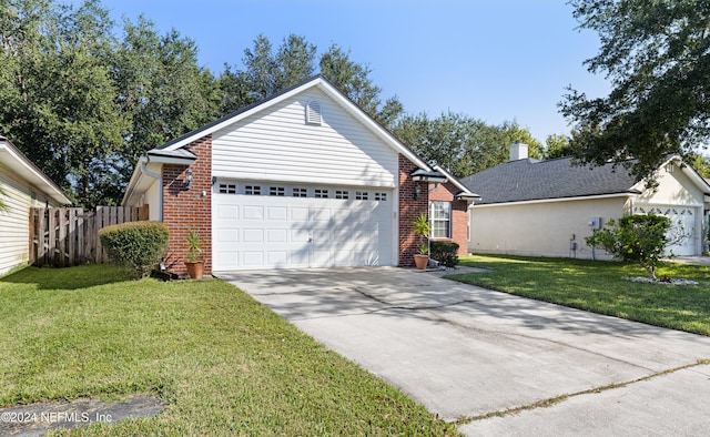 single story home featuring a front yard and a garage