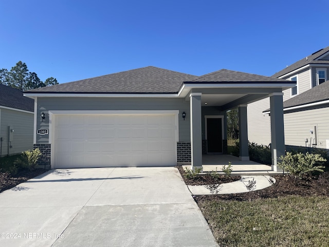 view of front of property with a garage