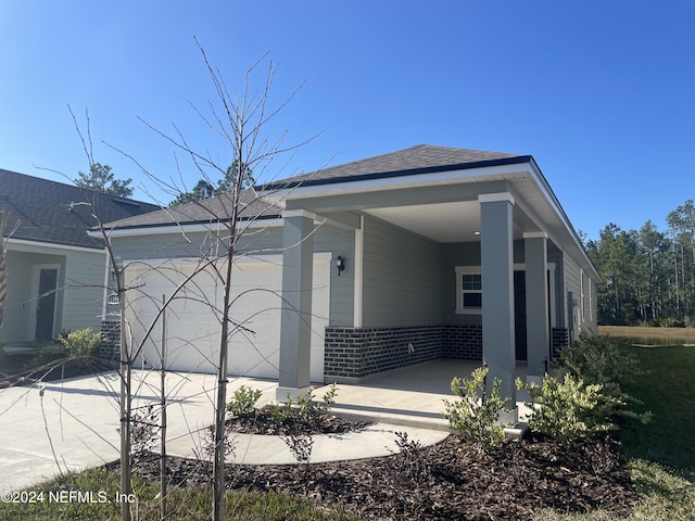 view of front of property featuring a carport