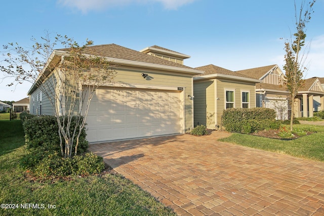 view of front of property with a garage