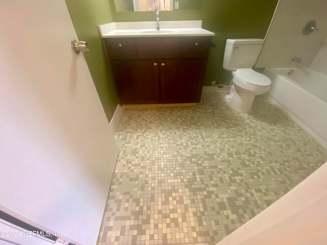 full bathroom featuring vanity, shower / washtub combination, toilet, and tile patterned flooring