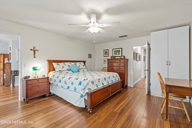 bedroom featuring light wood-type flooring and ceiling fan