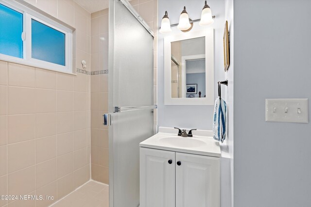 bathroom with vanity and walk in shower