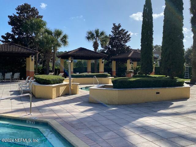 exterior space featuring a patio and a gazebo