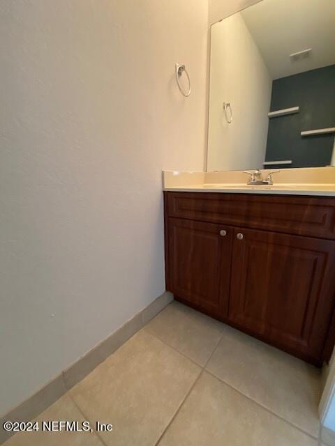 bathroom with vanity and tile patterned floors