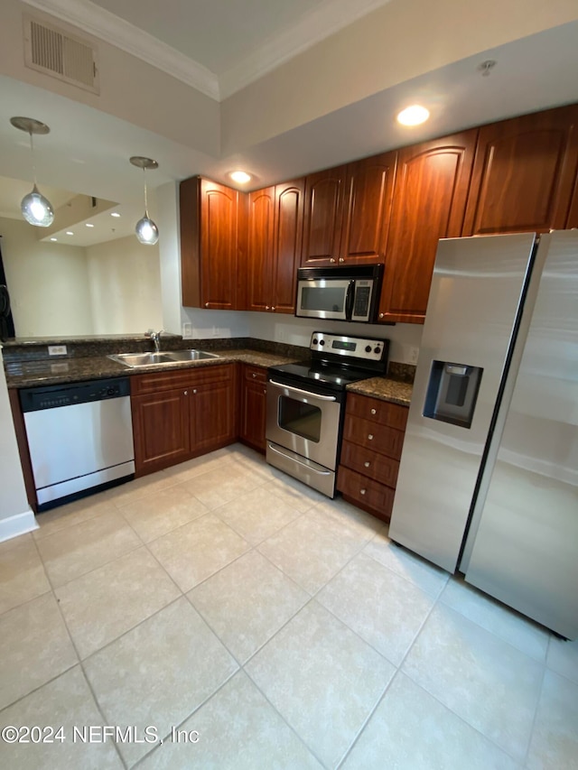 kitchen featuring sink, appliances with stainless steel finishes, light tile patterned floors, decorative light fixtures, and crown molding