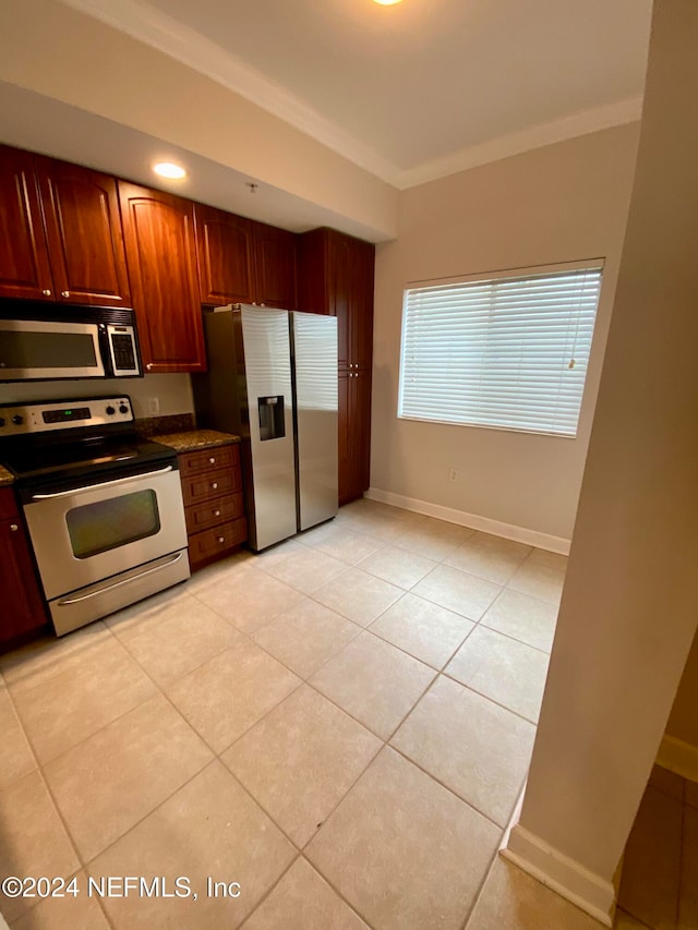 kitchen with light tile patterned floors and appliances with stainless steel finishes