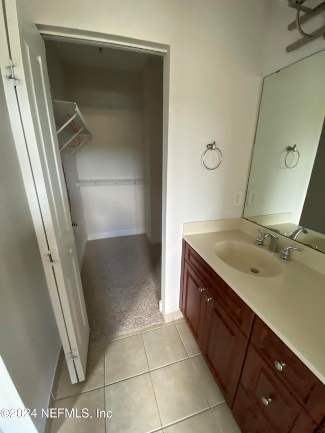 bathroom with vanity and tile patterned floors