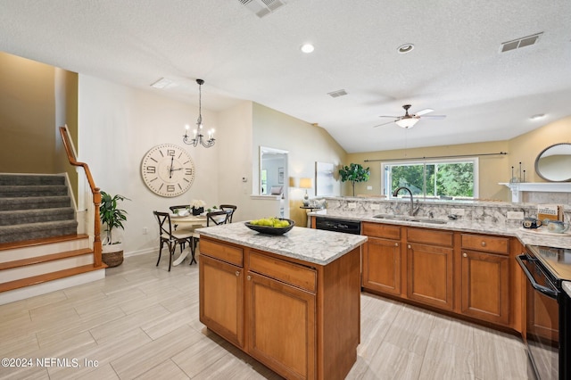 kitchen featuring black appliances, a center island, sink, pendant lighting, and vaulted ceiling