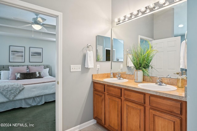 bathroom with ceiling fan, vanity, and tile patterned floors