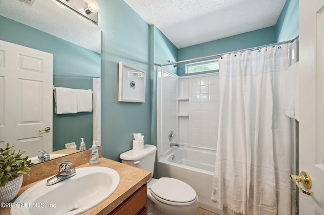 full bathroom with shower / tub combo with curtain, a textured ceiling, vanity, and toilet