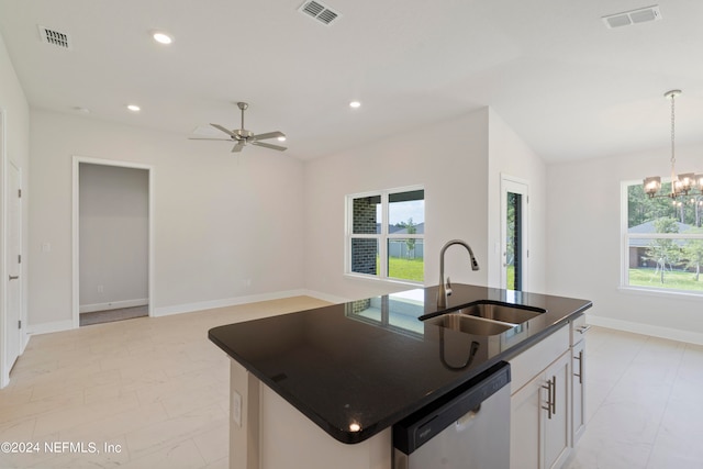 kitchen with pendant lighting, an island with sink, sink, white cabinetry, and dishwasher