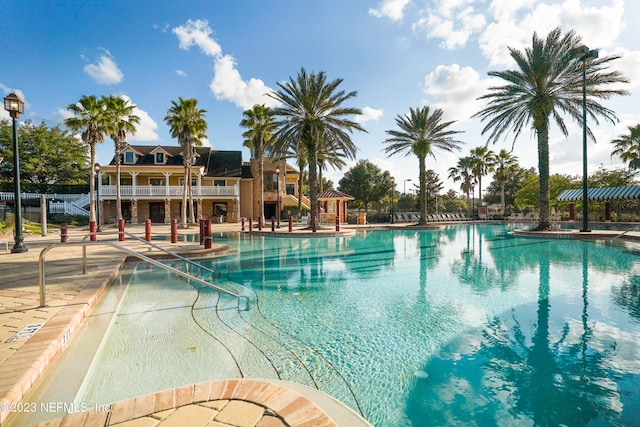 view of swimming pool featuring a patio