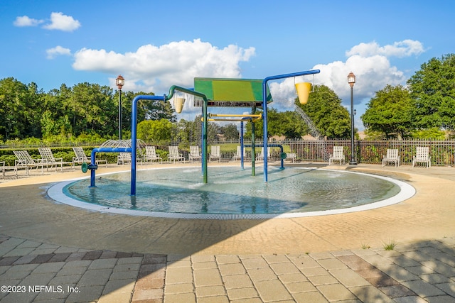 view of property's community featuring a playground