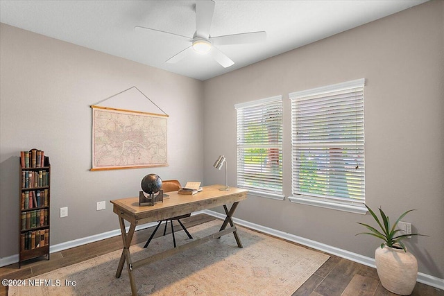 office space featuring dark wood-type flooring and ceiling fan