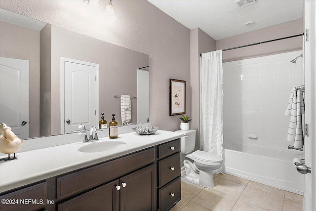 full bathroom with vanity, shower / bath combo, toilet, and tile patterned floors