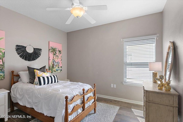 bedroom featuring hardwood / wood-style floors and ceiling fan