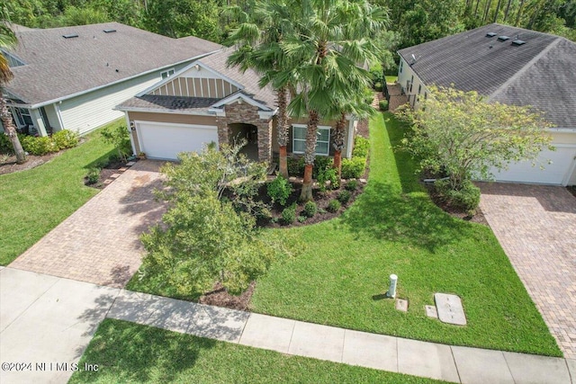 view of front facade with a front yard and a garage