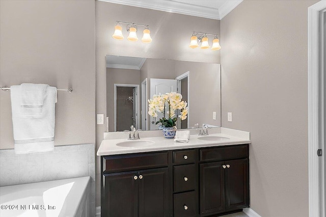 bathroom with a bathtub, crown molding, and vanity