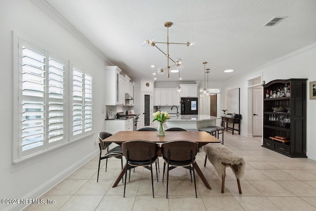 dining room featuring crown molding, light tile patterned flooring, and a notable chandelier